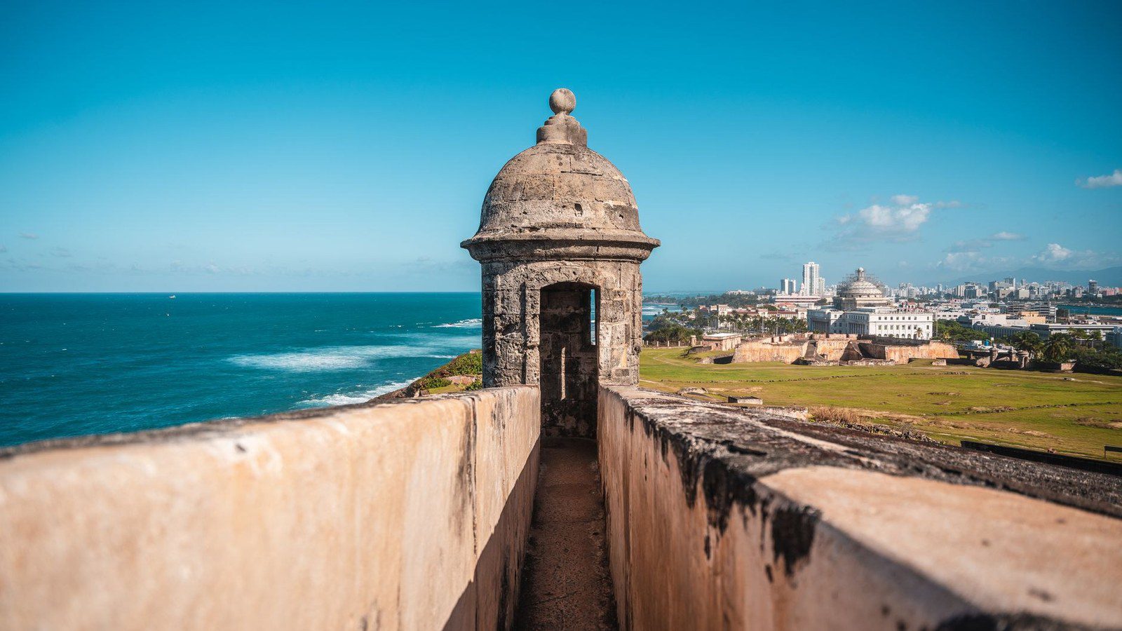 Massive stone ramparts and watchtowers of Castillo San Felipe del Morro overlooking the Atlantic Ocean in San Juan, Puerto Rico